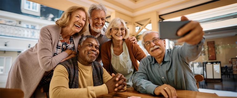 A group of seniors smiling for a photo.